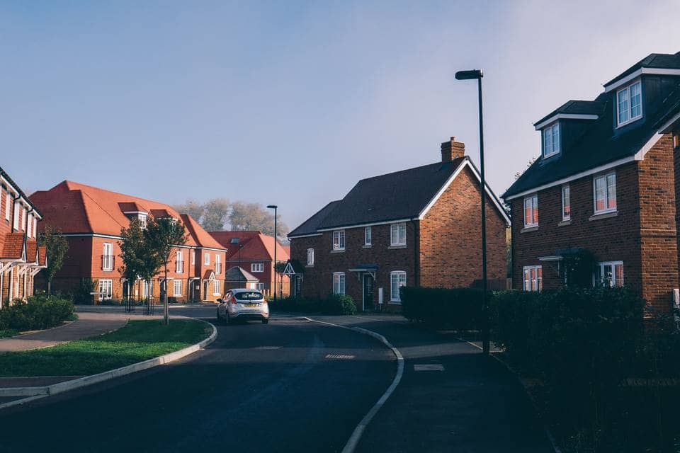 A street of new red-brick homes on a recently built estate A street of new red-brick homes on a recently built estate